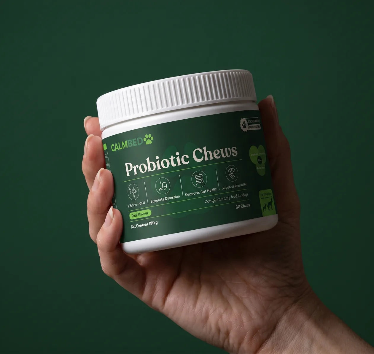 CalmBed Probiotic Chews jar held in hand